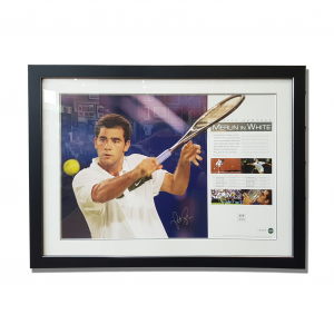 Pete Sampras memorabilia - a photo of Pete swinging his raquet sits alongside his career highlights and signature. It is a black timber frame.